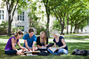 Is My Young Adult with an Eating Disorder Ready for College? [image description: young adults sitting on grass hanging out together]