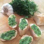 image description: slices of baguette with chimichurri on top
