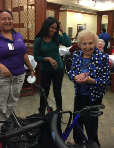 Living 100 years in Diet Culture [image description: my grandmother standing by her walker with other people]