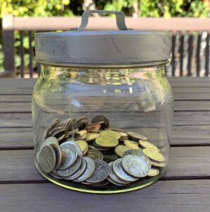 Easing Grief Through Connection (Coping Strategy for the Holidays) [Image description: jar of dimes]