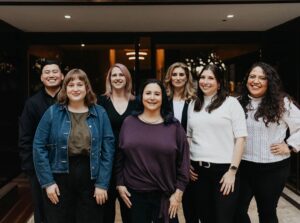 Eating Disorder Therapy LA Therapists in Los Angeles [Image description: 7 therapist members of the EDTLA team standing in front of the building in mid-Wilshire]