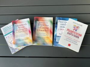 When Your Teen Has an Eating Disorder in English, Spanish, Russian, Turkish, and Bulgarian [Image description: photo of the 5 different versions of the book spread on a table]